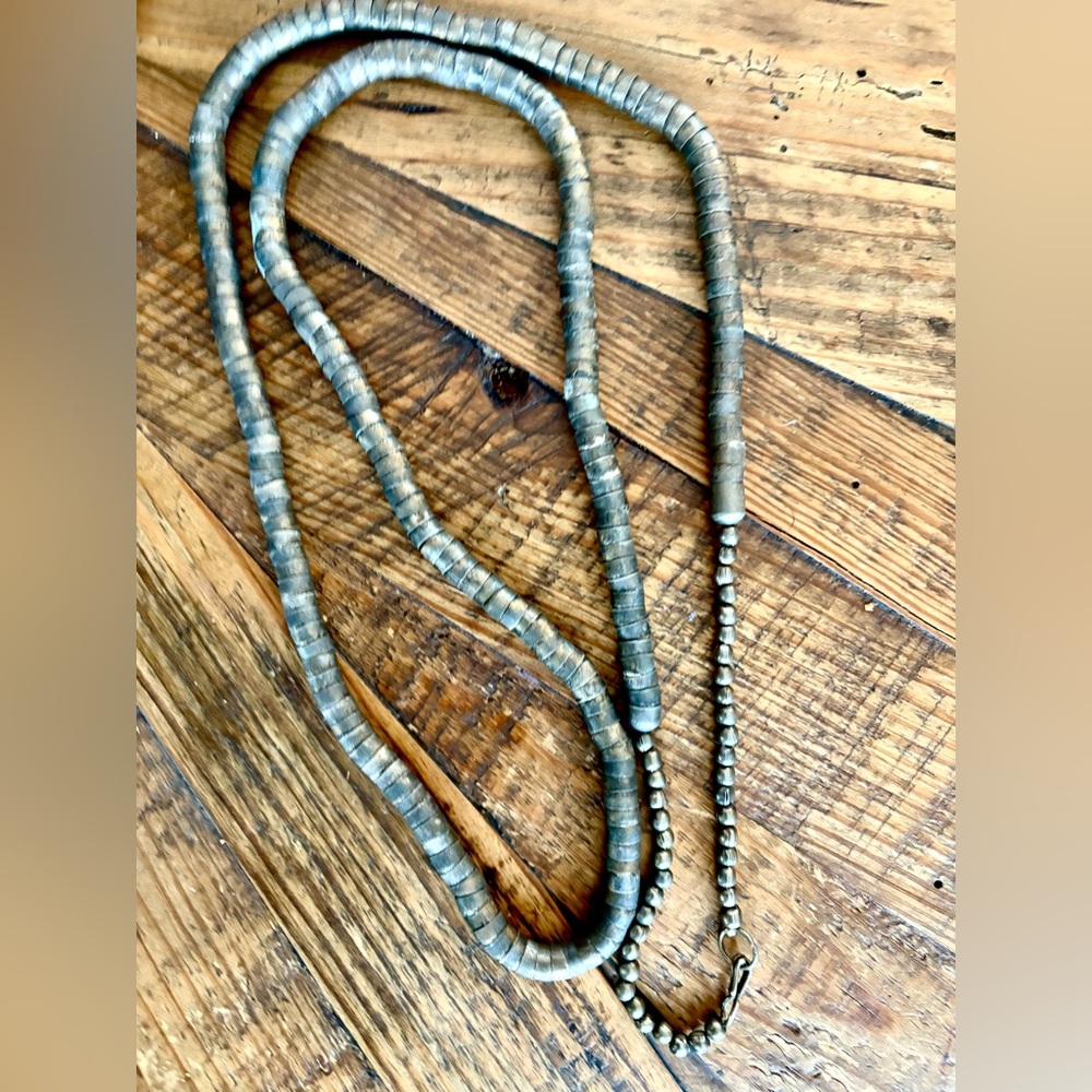 Very heavy articulated metal necklace with great patina. Can be double looped.